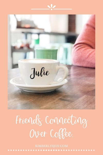 Photo of coffee cup during friends having coffee together