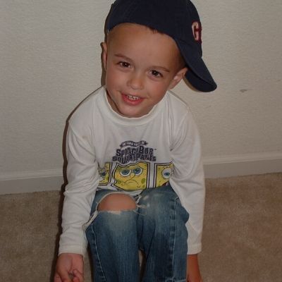 Toddler-Tyler-Funk-posing-in-hole-in-the-knees-jeans