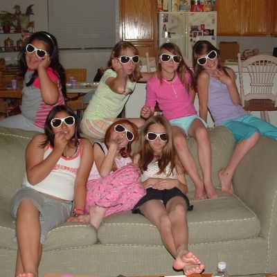 Girls-posing-with-sunglasses-during-sleepover