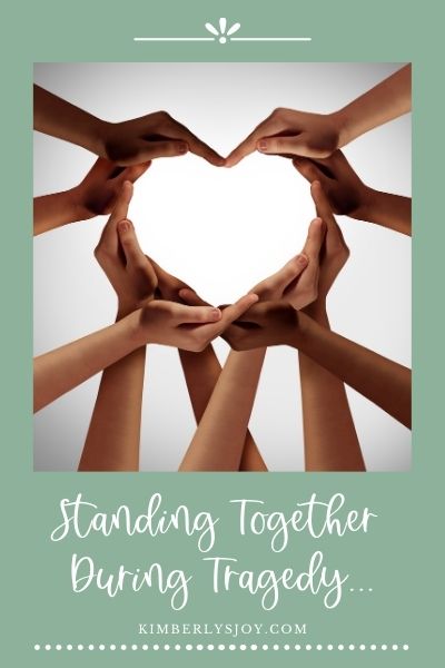 Standing-together-diverse-hands-creating-heart-shape