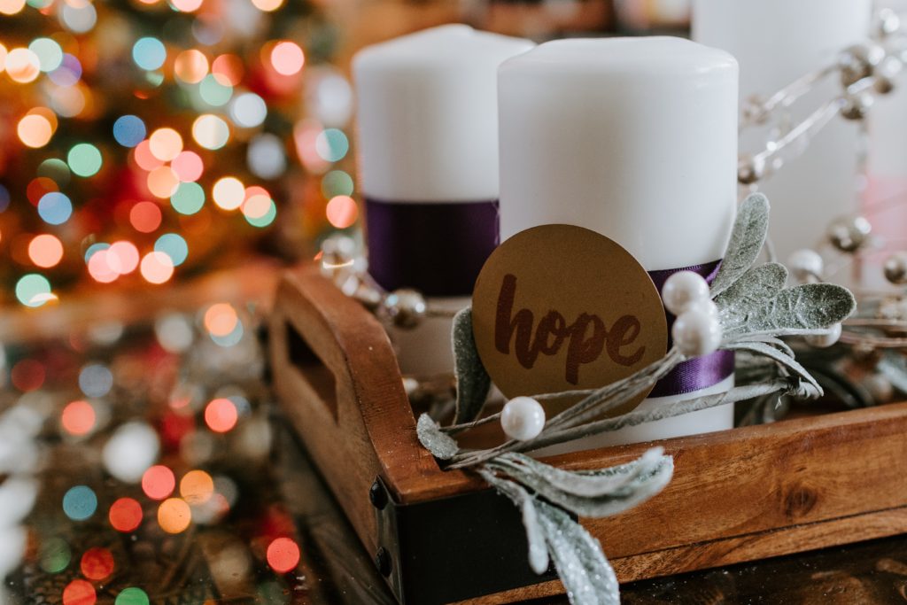 Hope tag with candles and Christmas lights in the background